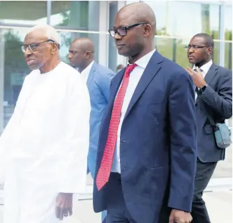  ?? AP ?? Former president of World Athletics, Lamine Diack (left), arrives at the Paris courthouse ahead of his corruption trial on Wednesday.