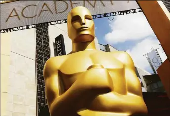  ?? Matt Sayles / Associated Press ?? An Oscar statue outside the Dolby Theatre for the Academy Awards in Los Angeles, Calif., on Feb. 21, 2015.