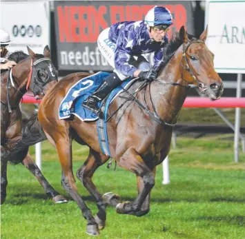  ?? Picture: TASRACING ?? IMPRESSIVE: Blaze Forth (Brendon McCoull) charges to the line in Launceston.