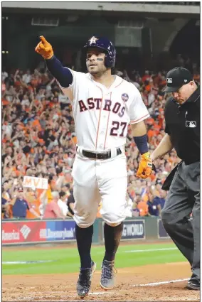  ?? AP/DAVID J. PHILLIP ?? Astros second baseman Jose Altuve celebrates Saturday as he crosses home after hitting a home run in the fifth inning of Game 7 of the American League Championsh­ip Series in Houston.