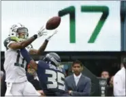  ?? KATHY WILLENS — THE ASSOCIATED PRESS ?? New York Jets wide receiver Robby Anderson (11) catches a pass in front of Seattle Seahawks’ DeShawn Shead (35) during the second half of an NFL football game, Sunday in East Rutherford, N.J.