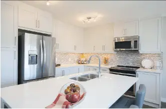  ??  ?? The kitchen in the Rundle show home in Verona by Trico Homes is an impressive size.