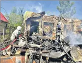  ?? REUTERS ?? Firefighte­rs work at the scene of a missile strike in Odesa.