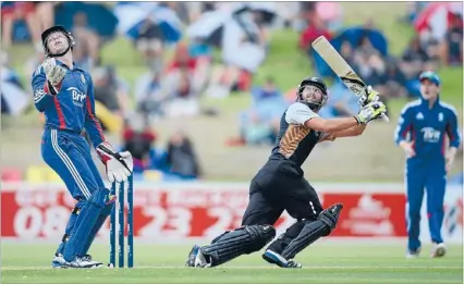  ?? Photo: GETTY IMAGES ?? Hitting freely: The New Zealand XI’s Anton Devcich hits past England wicketkeep­er Jos Buttler during yesterday’s washed-out T20 match in Whangarei.