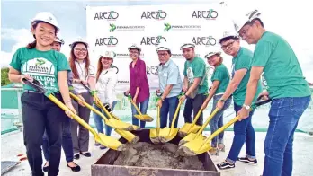  ?? MACKY LIM ?? TOPPING OFF. Last September 8, 2017, Phinma Properties’ Arezzo Place, located at Doña Pilar, Sasa, Davao City, topped off its 4th building, which is targeted to be fully completed by the first quarter next year.