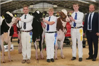  ?? ?? JOHN MCGREGOR and Son’s yearling heifer, Glenvalley Sidekick Hope, won the calf championsh­ip led by son Cameron McGregor; reserve was David Gray’s Grayridge Milo Laurie Sheik and honourable mention was Brian and Michael Yates’ Logan Jordy Kiwi Red; photograph­ed with judge Max Davie (right)