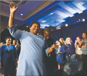  ?? (AP/John Amis/File) ?? Stacey Abrams, Georgia Democratic gubernator­ial candidate, leaves the stage Nov. 6, 2018, after addressing supporters during an election night watch party in Atlanta. She centered her campaign on women of color. In the election, more than 51,000 Black women in Cobb County cast ballots, a number typical for presidenti­al election years but spectacula­r for midterms, eclipsing the turnout of the 2014 midterm by nearly 20,000 votes.