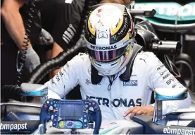  ??  ?? Mercedes driver Lewis Hamilton of Britain gets into his car during the first practice session at the Belgian Formula One Grand Prix circuit in Spa-Francorcha­mps yesterday