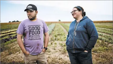  ?? CHRIS WALKER/CHICAGO TRIBUNE PHOTOS ?? PrairiErth Farm owners Hans, left, and Katie Bishop left comfortabl­e jobs in the insurance industry to start their farm.