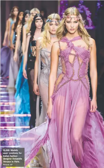  ?? Picture: AP ?? GLAM: Models wear creations for Italian fashion designer Donatella Versace in Paris.