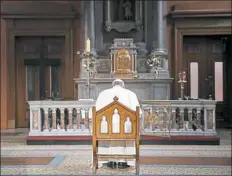  ?? Stefano Rellandini/Pool Photo via AP ?? Pope Francis prays inside St Mary’s Pro-Cathedral.