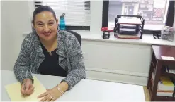  ??  ?? CHICAGO: In this Dec 16, 2016 photo, Esperanza Villalobos, a “community navigator,” works at her office at The Resurrecti­on Project. — AP