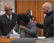  ?? ERIC BONZAR — THE MORNING JOURNAL ?? Tracey Payton-Johnson, widow of 47-year-old Jeffrey A. Johnson, is consoled as she openly weeps while talking about the impact her husband’s death has had on her and her family April 9. Andre L. Sanford, 26, of Elyria, was sentenced to eight years in...