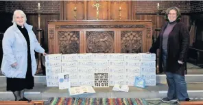  ??  ?? Reverend Canon Veronica Hydon and Beverley Nixon, from St Oswald Church, Bollington, with the shoeboxes