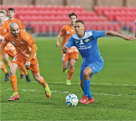  ?? Photo: Kevin Farmer ?? AT THE DOUBLE: South West Queensland Thunder striker Travis Cooper (right) scored twice in his side’s 5-0 defeat of Cairns on Saturday at Toowoomba’s Clive Berghofer Stadium.