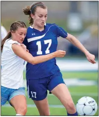  ?? NWA Democrat-Gazette/CHARLIE KAIJO ?? Southside’s Kelly Carson
(left) and Rogers defender Ashlynn Robinson fight for possession of the ball during the Class 7A girls soccer state tournament Saturday at Rogers High School.