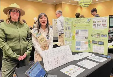  ?? National Park Service/Contribute­d photo ?? Kristin Lessard, park ranger and Gisella Castagna’s project adviser, left, with Castagna, right, at the Girl Scouts Gold Award ceremony.