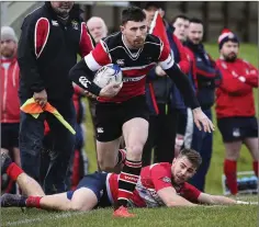  ??  ?? Wicklow’s Dean Leonard breaks this Mullingar tackle.