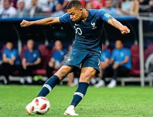  ?? GETTY IMAGES ?? Power play: Mbappe’s muscles bulge as he fires France’s fourth