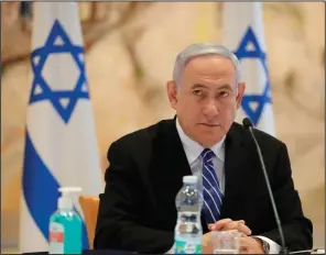  ??  ?? Israeli Prime Minister Benjamin Netanyahu attends the first Cabinet meeting of his new government Sunday in Jerusalem. His coalition deal includes a clause that allows him to present his annexation plan to the government in July.
(AP/Abir Sultan)