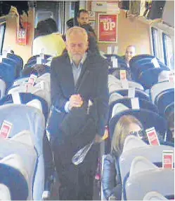  ?? Picture: PA. ?? The UK Labour leader making his way through a coach around eight minutes after departure from King’s Cross in London.