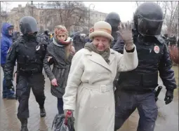  ?? The Associated Press ?? Policemen detain participan­ts of an unauthoriz­ed rally in St. Petersburg, Russia, on Saturday. A few dozens protesters were detained by police during a protest called for by the opposition movement Open Russia to oppose president Putin’s candidacy in...