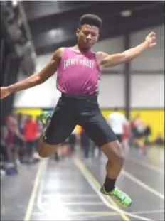  ?? PETE BANNAN — DIGITAL FIRST MEDIA ?? Garnet Valley’s Larry Coaxum takes his final attempt in the long jump at the Delaware County boys indoor track and field championsh­ips in January. Coaxum won the long jump and triple jump at Saturday’s Meet of Champions.