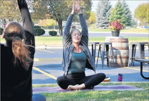  ?? BILL JONES/DAILY SOUTHTOWN ?? Ryann Jackson leads the October Doom Yoga class Saturday morning at Soundgrowl­er Brewing Co. in Tinley Park.