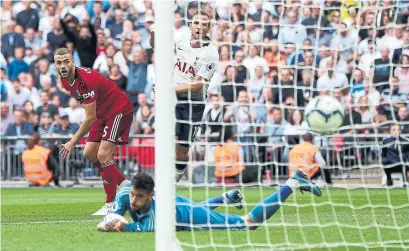  ?? TOTTENHAM HOTSPUR FC/GETTY IMAGES ?? Harry Kane scores the clincher for Tottenham Hotspur during a 3-1 win against Fulham on Saturday at Wembley Stadium in London.