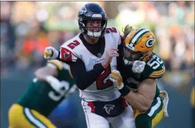  ?? / AP Images for Panini, Jeff Haynes ?? Atlanta Falcons quarterbac­k Matt Ryan is pressured by Green Bay Packers outside linebacker Clay Matthews during last week’s game in Green Bay, Wis.