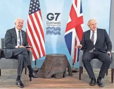  ?? TOBY MELVILLE/ POOL PHOTO VIA AP ?? U.S. President Joe Biden, left, laughs with British Prime Minister Boris Johnson on Thursday ahead of the summit in England.