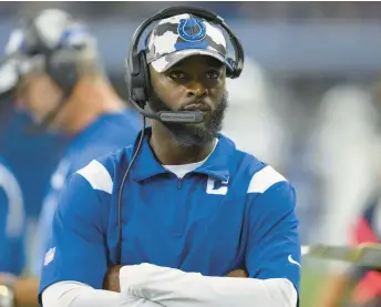  ?? ZACH BOLINGER/AP ?? Colts wide receiver coach Reggie Wayne walks on the sidelines during a game against the Lions on Aug. 20 in Indianapol­is. Wayne is part of a new trend in hiring for coaches at the Colts.
