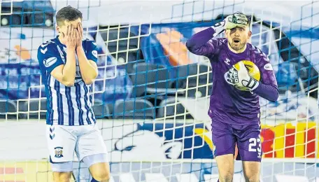  ??  ?? Jamieson.
Kilmarnock goalkeeper Danny Rogers can’t believe the assistant referee has adjudged the ball crossed the