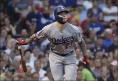  ?? ELISE AMENDOLA - THE ASSOCIATED PRESS ?? FILE - In this Friday, July 12, 2019 file photo, Los Angeles Dodgers’ Alex Verdugo watches his solo home run during the second inning of the team’s baseball game against the Boston Red Sox at Fenway Park in Boston.