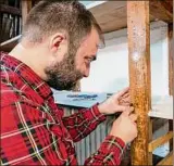  ?? Jim Franco/Special to the Times Union ?? Ben Brower helps to renovate shelving that will hold the tools for the library.