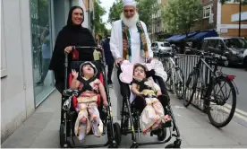  ??  ?? Safa and Marwa Ullah leave hospital with their mother and their grandfathe­r. Photograph: Great Ormond Street Hospital/PA