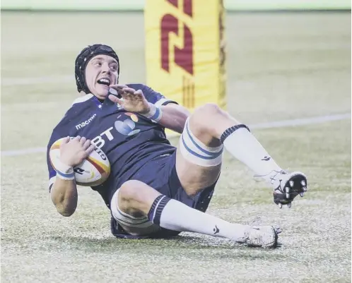  ??  ?? Lewis Carmichael scores a try on his Scotland debut, against Canada in Edmonton in 2018