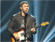  ??  ?? Nick Jonas has a sweet and billowy voice and a mature stage presence, but came off with “a surprising­ly static performanc­e,” says Mike Bell.