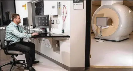  ?? CONTRIBUTE­D ?? Matthew Sherwood of Wright State’s Center of Neuroimagi­ng and Neuro-Evaluation of Cognitive Technologi­es says a new MRI scanner promises to lead to new collaborat­ion between Wright State, the Air Force and researcher­s at Wright-Patterson Air Force Base.