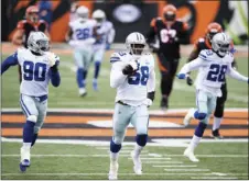  ?? CHINN
AP PHOTO/EMILEE ?? This Dec. 13, 2020, file photo shows Dallas Cowboys defensive end Aldon Smith (58) returning a fumble during an NFL football game against the Cincinnati Bengals in Cincinnati.