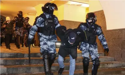  ?? Photograph: Sergei Bobylev/TASS ?? Riot police officers detain a participan­t in an unauthoris­ed rally in support of Alexei Navalny in Moscow in February.