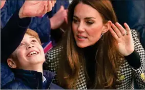  ?? ?? KICKER: Xtyxt xtyx xtyxtyx xtyx xty xtyxty xtyx xtyxt xtyxt xty xty xtyxty xt yx tyx xtyxtyxtyx xtyxt
FACES IN THE CROWD: George excited by the game and, left, arriving with mum