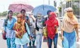  ?? ?? File photo of women protecting themselves from the heat