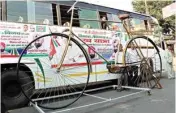  ??  ?? SP members prepare a model of cycle, party symbol, for UP Chief Minister Akhilesh Yadav’s Rath Yatra, in Meerut on Wednesday