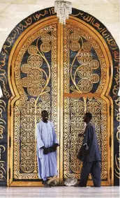  ??  ?? Religious culture An ornately decorated door at the Great Mosque in Touba, Senegal. Islam has played a key role in that nation’s cultural developmen­t