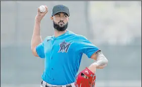  ?? Jeff Roberson The Associated Press ?? Miami Marlins pitcher Sandy Alcantara throws live batting practice during a spring training workout Sunday in Jupiter, Fla.