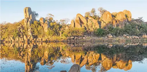  ?? CHRISTOPHE­R SCOTT PHOTOS/THE NEW YORK TIMES ?? Granite outcroppin­gs at Matobo National Park in Zimbabwe. The wilderness is a vast field of granite domes and broken blocks rising from swampy, verdant valleys.