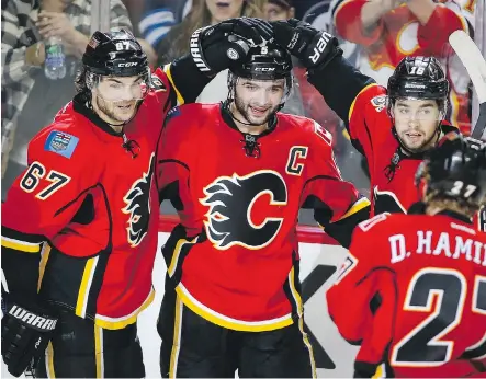  ?? JEFF McINTOSH/THE CANADIAN PRESS/FILES ?? The Flames hope to be doing more celebratin­g with power play goals. Right now, it’s stumbling at a league-worst 8.3 per cent efficiency. How to work the power play has become an area of focus at practices.