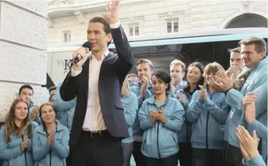  ?? PICTURE: AP ?? Foreign Minister Sebastian Kurz, head of the Austrian People’s Party, waves during a brief campaign rally in Vienna ahead of the national elections yesterday.