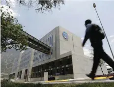  ?? — Reuters ?? A man walks past the Global Operations Center of General Electric Co.